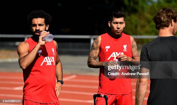 Mohamed Salah and Roberto Firmino of Liverpool during a training session on July 30, 2019 in Evian-les-Bains, France.