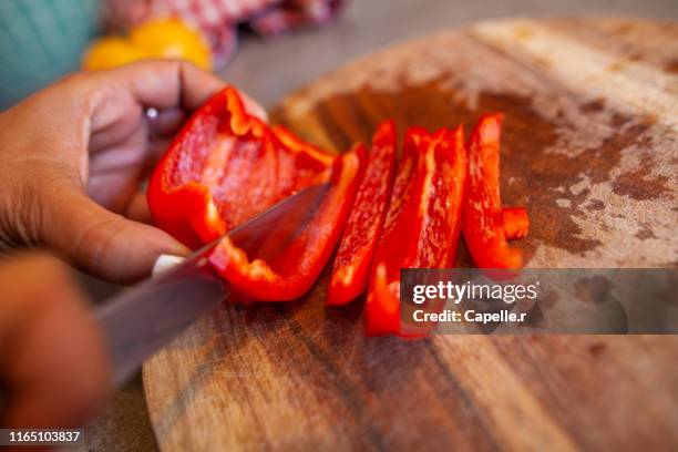 cuisine - découpe de poivrons - red bell pepper stock pictures, royalty-free photos & images