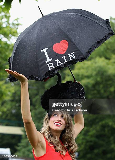 Lady in a hat poses for a photograph on Ladies Day at Royal Ascot at Ascot Racecourse on June 14, 2011 in Ascot, United Kingdom.