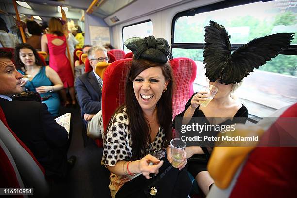 Race goers ride a train to Ascot on June 16, 2011 in London, England. Ladies Day at Royal Ascot includes the highlight Gold Cup race attended by...