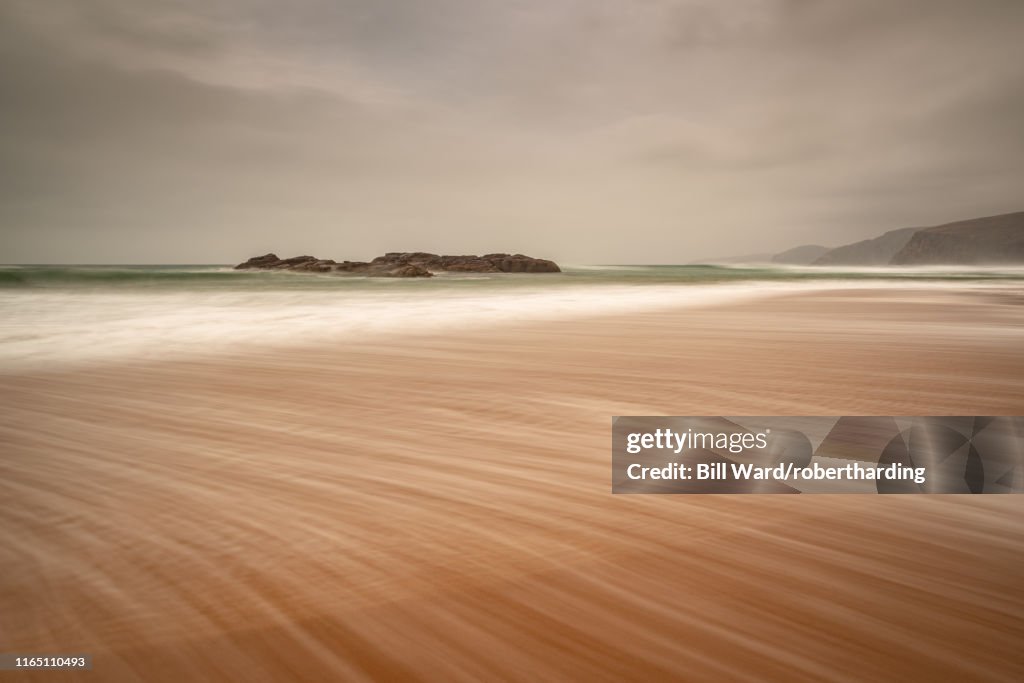 Sandwood Bay in early morning with Cape Wrath in far distance, Sutherland, Scotland, United Kingdom, Europe