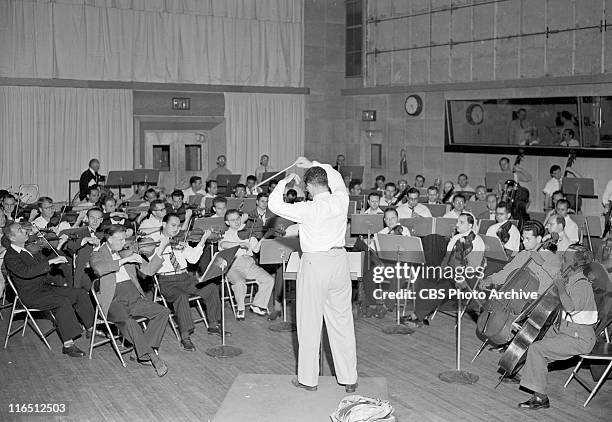 Bernard Herrmann conducting Columbia Broadcasting Symphony Orchestra. Image dated July 18, 1947.