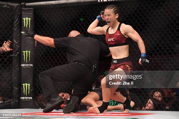 Zhang Weili of China celebrates after her victory over Jessica Andrade in their UFC strawweight championship bout during the UFC Fight Night event at...