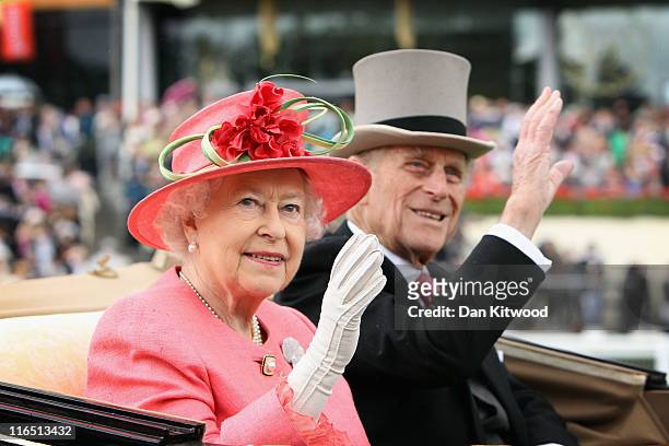 Queen Elizabeth ll and Prince Philip, Duke of Edinburgh arrive in an open carriage on Ladies Day at Royal Ascot on June 16, 2011 in Ascot, England....