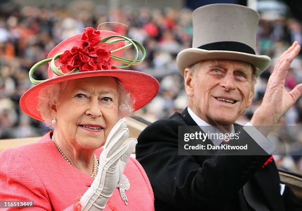 Queen Elizabeth ll and Prince Philip, Duke of Edinburgh arrive in an open carriage on Ladies Day at Royal Ascot on June 16, 2011 in Ascot, England....