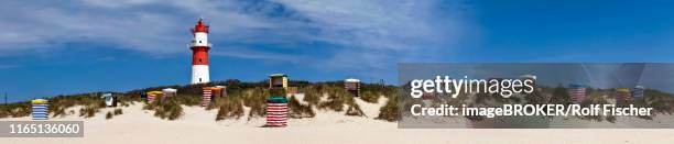 south beach with beach chairs and electric lighthouse, borkum, germany - ostfriesland stock-fotos und bilder