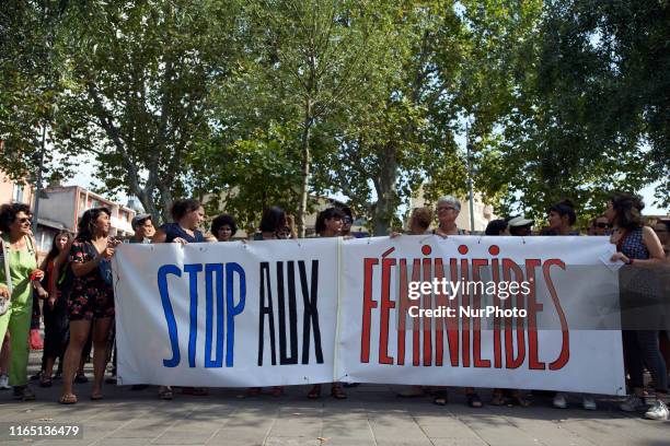 The banner reads 'Stop to feminicide'. Women organized a gathering in Toulouse to pay tribute to women victim of murder by their male partner. They...