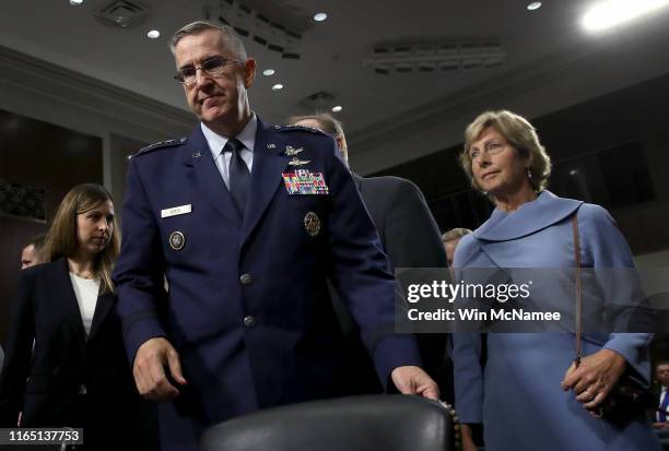 As his wife Laura looks on, U.S. Air Force Gen. John E. Hyten arrives for testimony before the Senate Armed Services Committee on his appointment as...