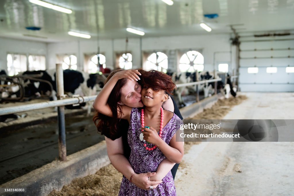 Young girl with autism connecting with cows.