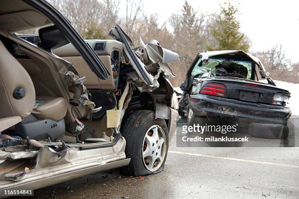 remaining debris of cars involved in a car crash on road - car accident stock pictures, royalty-free photos & images