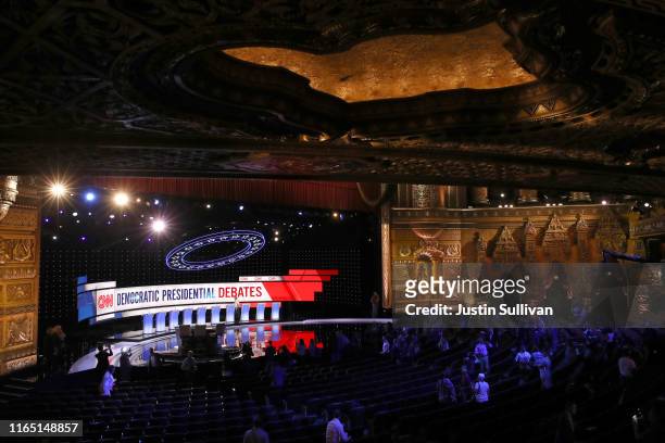 Workers prep the stage during a media briefing ahead of tonight's Democratic Presidential Debate at the Fox Theatre July 30, 2019 in Detroit,...