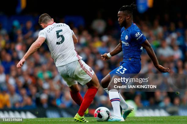 Sheffield United's English defender Jack O'Connell tackles Chelsea's Belgian striker Michy Batshuayi during the English Premier League football match...