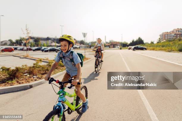 its a race! - kids cycling stock pictures, royalty-free photos & images