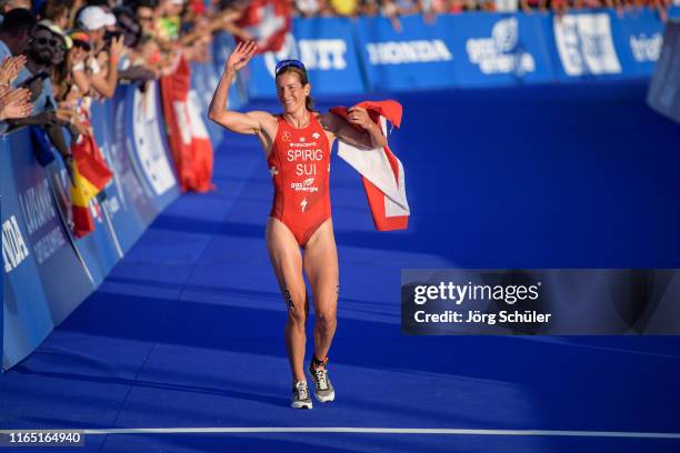 Nicola Spirig of Swiss reacts to the fans during the women's elite olympic race at the ITU World Triathlon Grand Final on August 31, 2019 in...