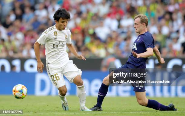 Takefusa Kubo of Real Madrid and Oliver William Skipp fight for the ball during the Audi cup 2019 semi final match between Real Madrid and Tottenham...