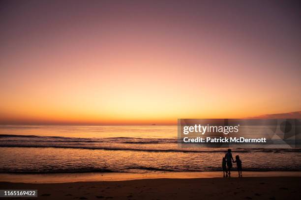 The sun rises before the start of the 5k and 1 mile races during the 19th running of the Rock n Roll Virginia Beach Half Marathon on August 31, 2019...