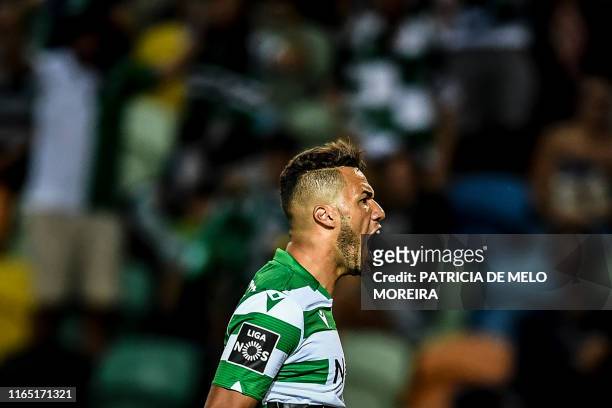Sporting's Brazilian forward Luiz Phellype celebrates after scoring during the Portuguese League football match between Sporting CP and Rio Ave at...
