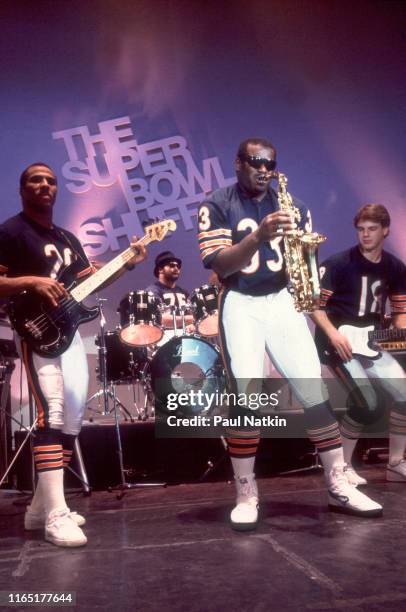 View of, from left, American football players Dennis Gentry, on bass, Stefan Humphries, on drums, Calvin Thomas, on saxophone, and Mike Tomczak, on...