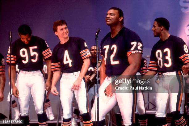 View of, from left, American football players, Richard Dent, Steve Fuller, William 'The Refrigerator' Perry, and Willie Gault, all of the Chicago...