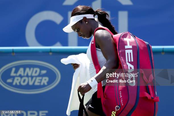 Sloane Stephens of the United States walks off the court after losing to Rebecca Peterson of Sweden during Day 2 of the Citi Open at Rock Creek...