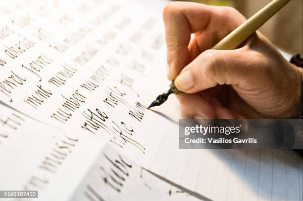 woman with calligraphy materials on table - greece message stock pictures, royalty-free photos & images