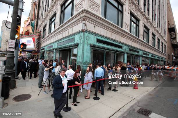 People wait in line to attend the Democratic Presidential Debate at the Fox Theatre July 30, 2019 in Detroit, Michigan. 20 Democratic presidential...