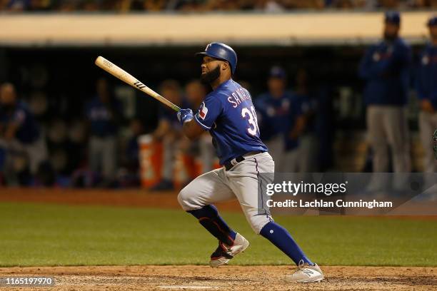 Danny Santana of the Texas Rangers at bat against the Oakland Athletics at Ring Central Coliseum on July 27, 2019 in Oakland, California.