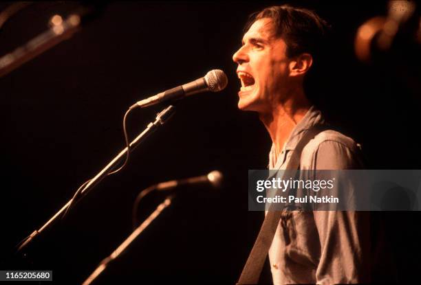 British/American New Wave musician David Byrne, of the group Talking Heads, plays guitar as he performs onstage at the Aragon Ballroom, Chicago,...