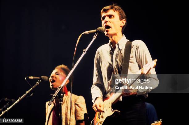 British/American New Wave musician David Byrne, of the group Talking Heads, plays guitar as he performs onstage at the Aragon Ballroom, Chicago,...