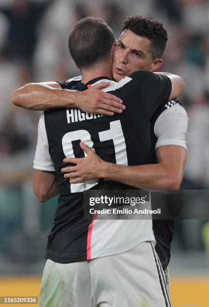 Cristiano Ronaldo of Juventus celebrates scoring the third goal of his team with his team-mate Gonzalo Higuain during the Serie A match between...