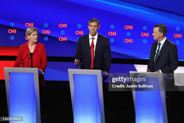 Democratic presidential candidate former Texas congressman Beto O'Rourke speaks as Sen. Elizabeth Warren and former Colorado governor John...