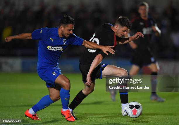 Luke Dreher of Crystal Palace is challenged by Egli Kaja of AFC Wimbledon during the Pre-Season Friendly match between AFC Wimbledon and Crystal...