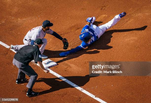 Vladimir Guerrero Jr. #27 of the Toronto Blue Jays is out at third base on a tag by Abraham Toro of the Houston Astros in the third inning during...
