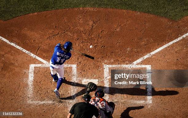 Bo Bichette of the Toronto Blue Jays hits a single against the Houston Astros in the sixth inning during their MLB game at the Rogers Centre on...