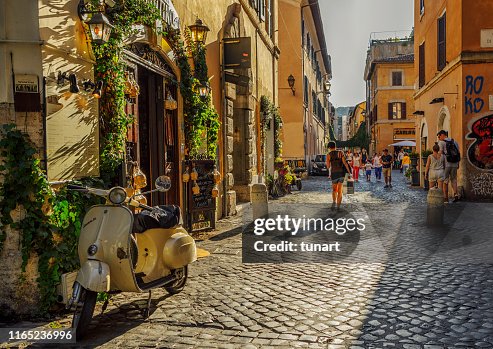 People and Buildings in an Alley of Trastevere, Rome, Italy People and Buildings in an Alley of Trastevere, Rome, Italy