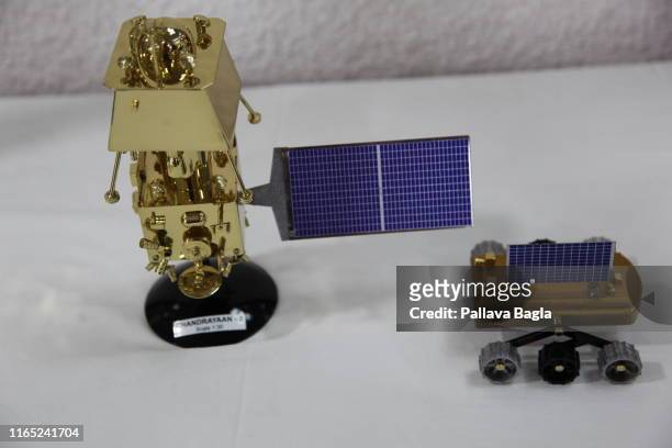 Scale models of the Indian moon shot on display at the head quarters of the Indian Space Research Organisation . These models were placed at the feet...