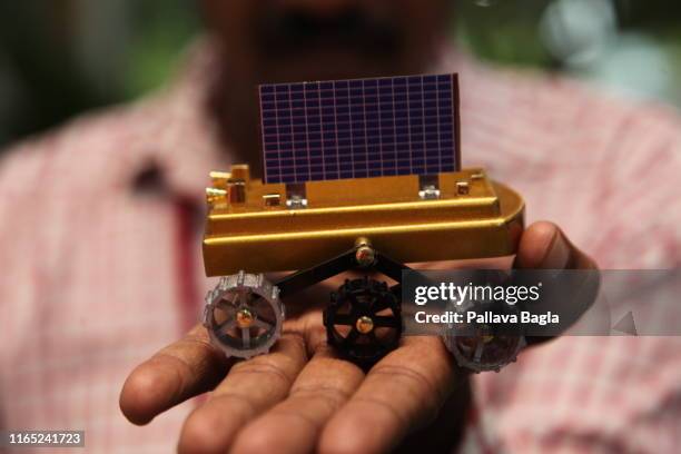 Scale models of the Indian moon shot on display at the head quarters of the Indian Space Research Organisation . These models were placed at the feet...