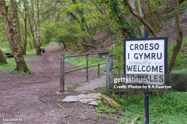 border of wales and england at knighton, powys, wales - powys stock pictures, royalty-free photos & images