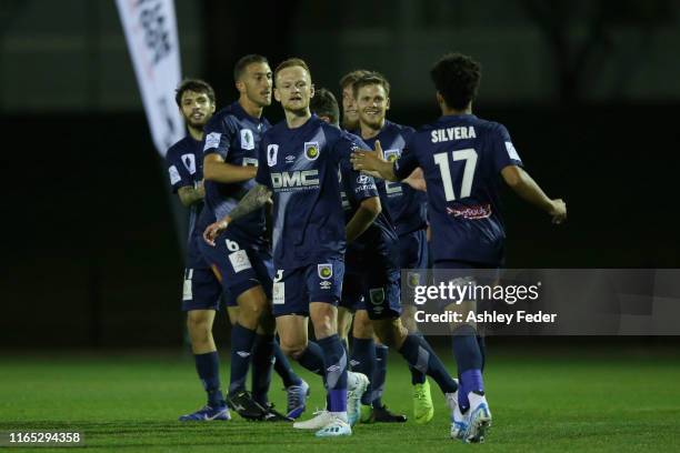 Michael McGlinchey of the Central Coast Mariners celebrates his goal with team mates during the FFA Cup Round of 32 match between Maitland FC and...