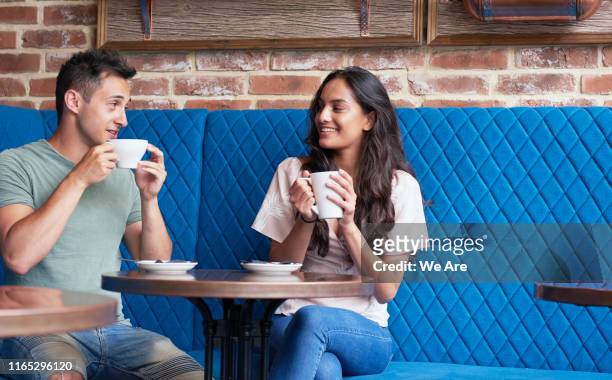 friends with coffee in cafe - dating stock pictures, royalty-free photos & images