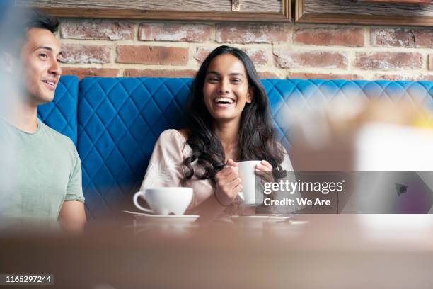 laughing woman with a cup of coffee - coffee indulgence stock pictures, royalty-free photos & images