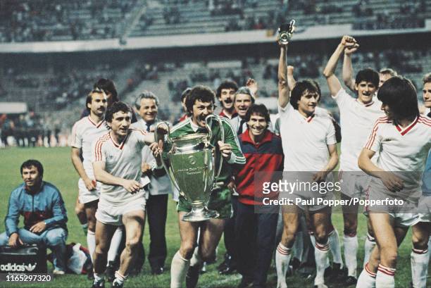 Romanian footballer Helmuth Duckadam, goalkeeper with Steaua Bucuresti, pictured holding the European Cup trophy during celebrations with his...