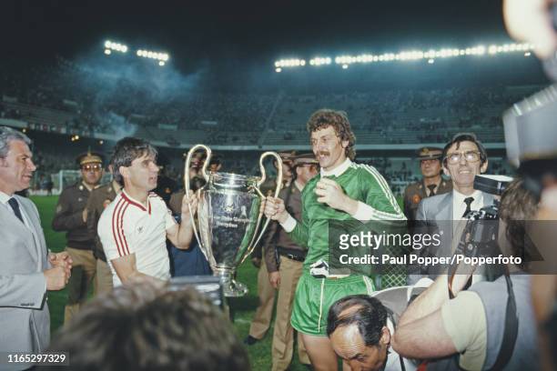 Romanian footballers Anghel Iordanescu and Helmuth Duckadam, midfielder and goalkeeper with Steaua Bucuresti, pictured together holding the European...