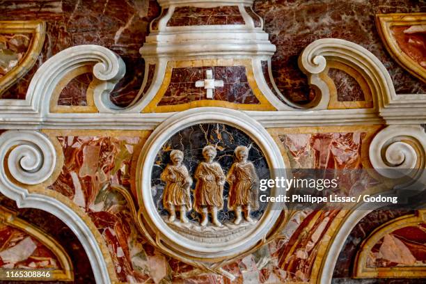 maria annunziata basilica cathedral, acireale, sicily (italy). relief detail showing martyr saints filadelfo, alfio & cirino. - acireale stock pictures, royalty-free photos & images