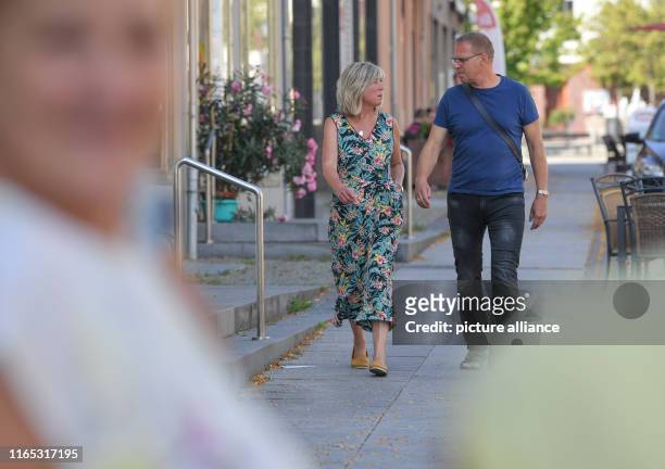 September 2019, Brandenburg, Calau: Kathrin Dannenberg, top candidate of the party Die Linke for the state election in Brandenburg and her husband...