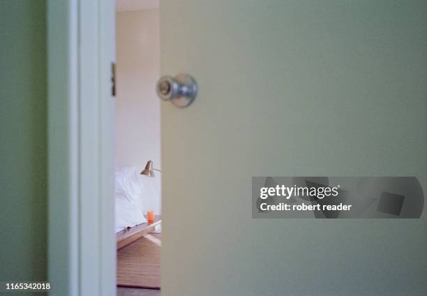 open door looking into bedroom - bedroom door stock pictures, royalty-free photos & images