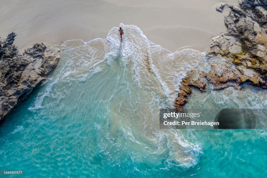 Aerial view of a woman walking out of the water_Little Exuma_Exuma_Bahamas