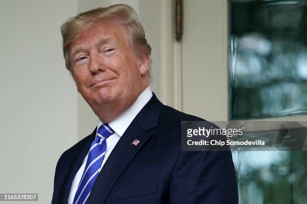 President Donald Trump looks back at journalists after welcoming Mongolian President Battulga Khaltmaa to the White House July 31, 2019 in...