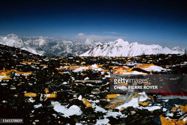Photo taken on March 10, 1993 shows garbage, gas cylinders, ropes, tents, cans and plastics on Mount EVerest, nicknamed "the world's tallest garbage...
