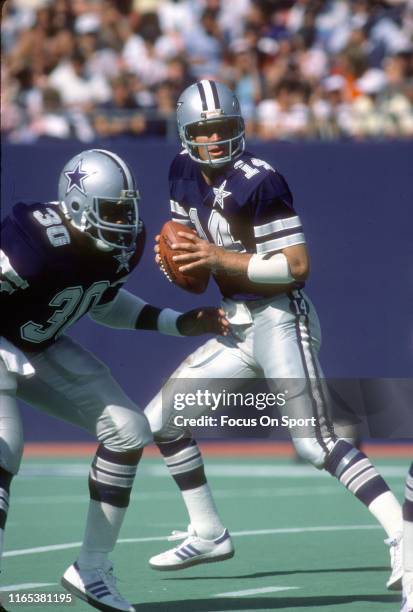 Quarterback Gary Hogeboom of the Dallas Cowboys drops back to pass against the New York Giants during an NFL football game September 9, 1984 at Giant...